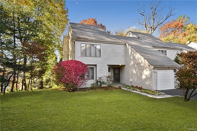 Unique freestanding townhouse in the Scarsdale school district with private front lawn