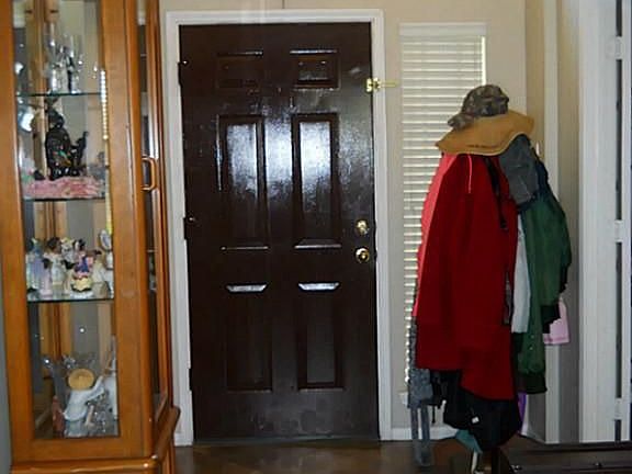 Ceramic tiled foyer extends to the living room and dining room