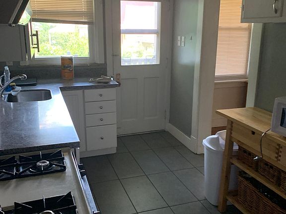 Kitchen with back door to covered porch