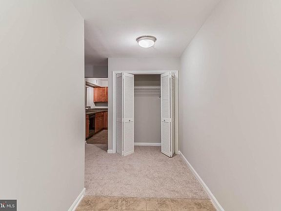 The foyer is tiled and what a great closet!