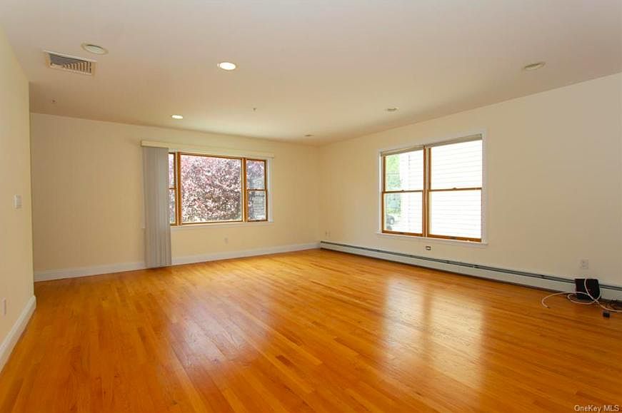 Large living room wood floors throughout.