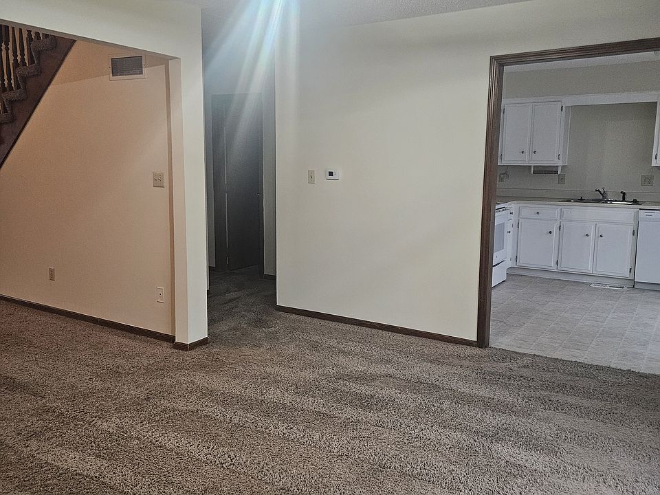 Dining room into kitchen and hallway to downstairs bedroom