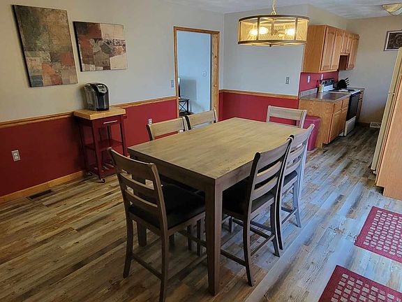 Connected dining room to kitchen. Newer luxury vinyl plank floors. Sliding door to deck and back yard.

Home is currently unfurnished; pictures show home staged.