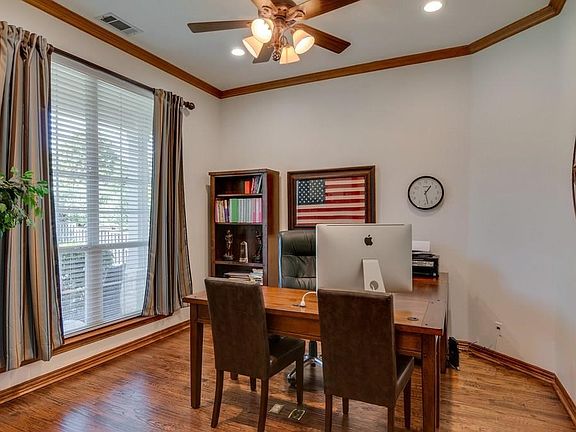 Find the study tucked behind attractive French doors with crown molding and wood floors.
