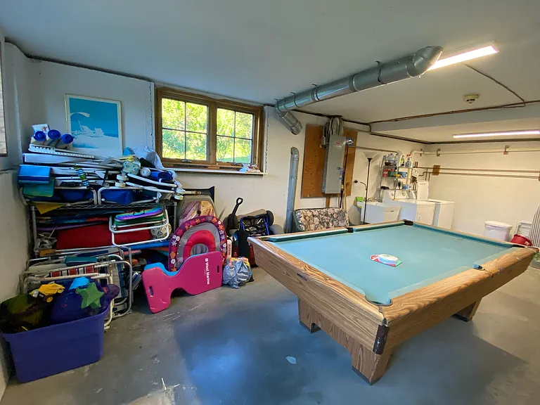 Pool table and beach supplies as well as washer and dryer in the ground floor