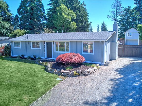 Extra wide driveway provides plenty of space for your rv, boat, and cars. 