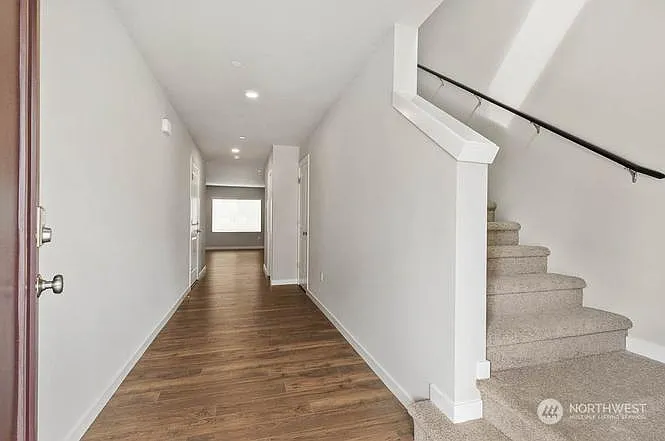 Welcoming Entryway with Open Staircase