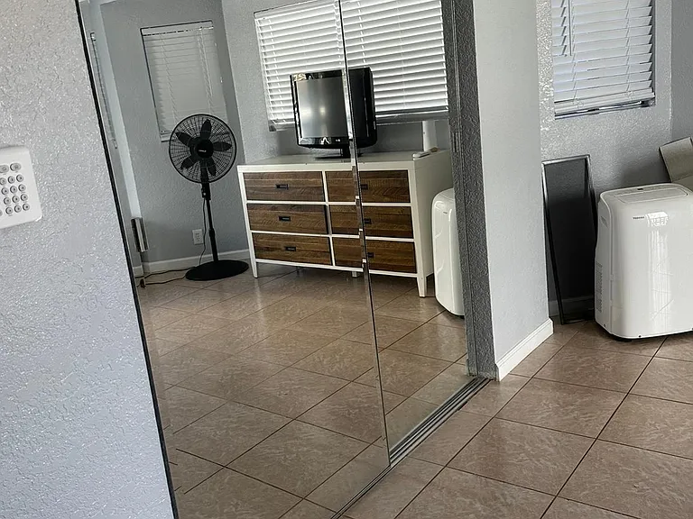 Mirrored closet-main bedroom