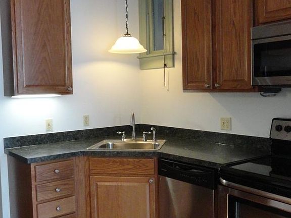 All stainless steel kitchen has dishwasher, self-cleaning oven and microwave.
