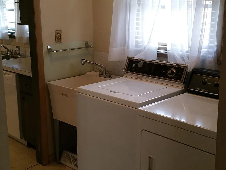 Laundry room off kitchen.