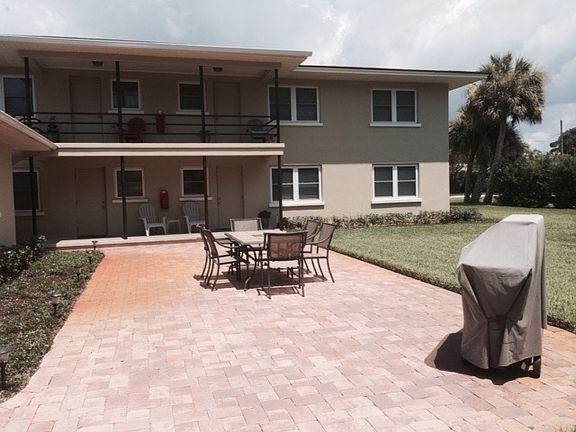 Common patio area with furniture and BBQ grill