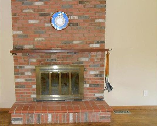 Fireplace in the living room for the frosty nights- remember those?