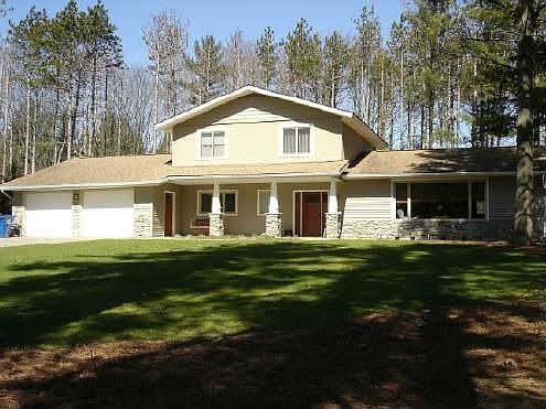 Front showing new craftsman columns, siding & stone accent