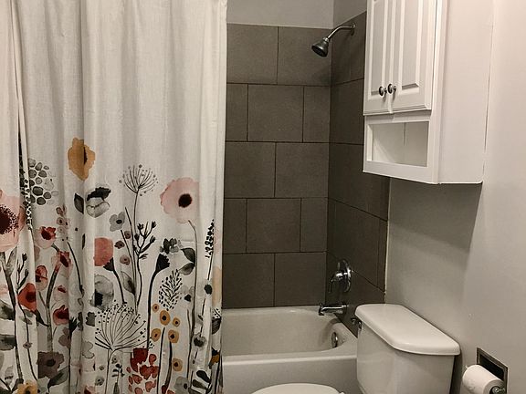 New Shower Curtain Included