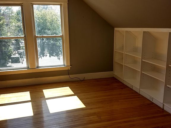 Lots of light in this living room with built-in bookcase