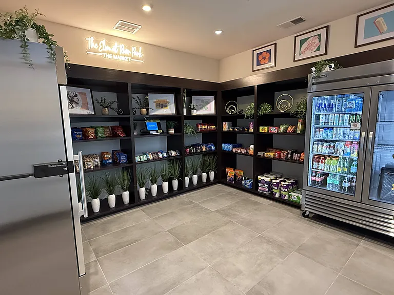 Resident Market With Open Shelving, Drinks, and Packaged Snacks