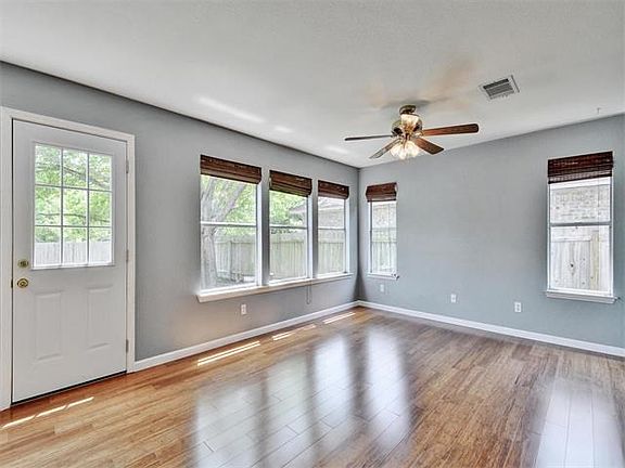 The bamboo flooring gives the family room a very elegant feel. There is a lot of natural light which