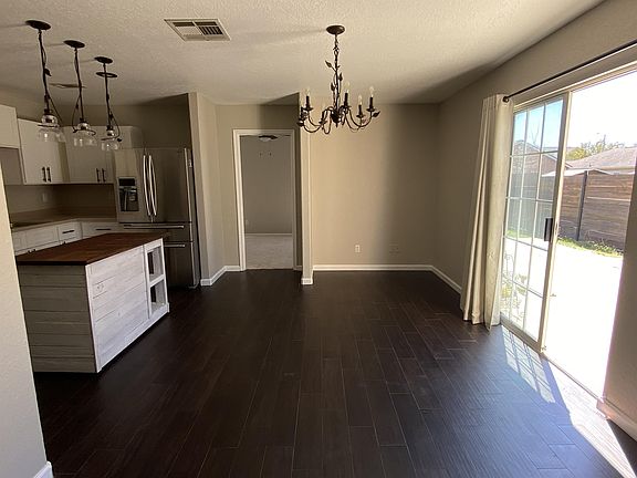 Kitchen eating area and sliding door to patio