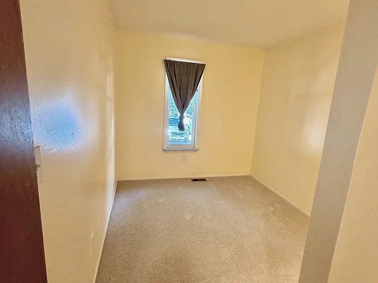 Second bedroom with new carpet in 2026