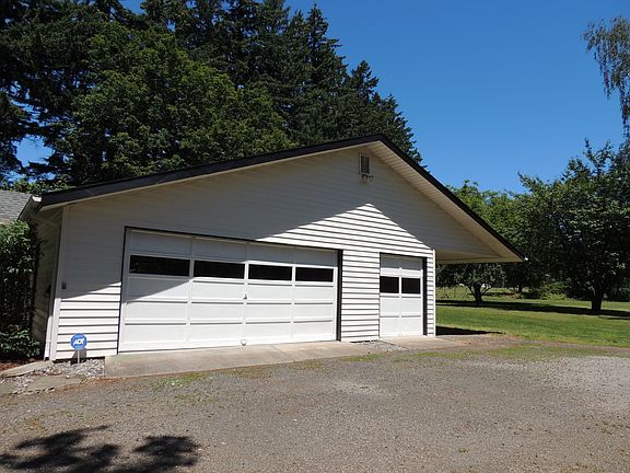 Detached garage with carport