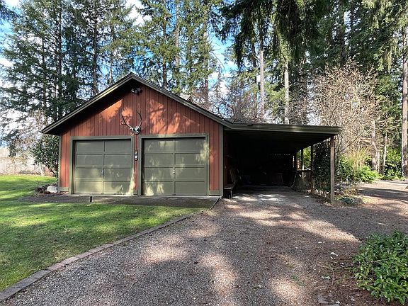 Parking space is inside carport to right