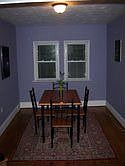 Dining Room, with Hardwood floor and new extra-large baseboard.