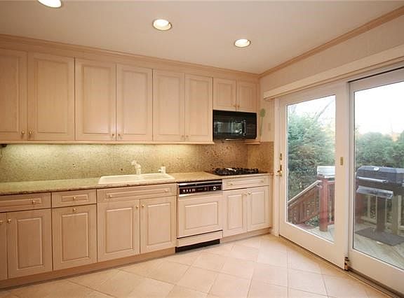 New kitchen with door to deck
