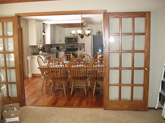 Dining room open to kitchen and double french doors to great room