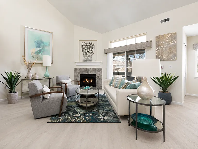 Family room in upper 3 bedroom units. Plank flooring in select units