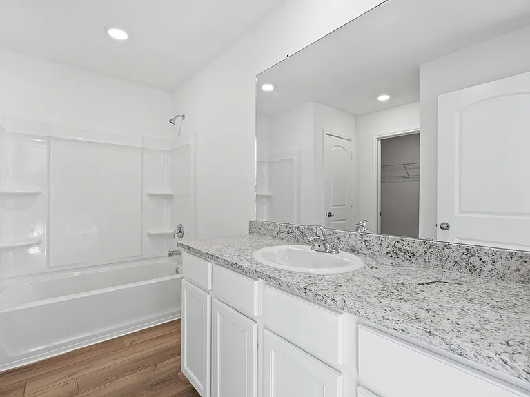 Master bathroom with a long vanity.