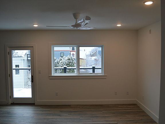 Living room with door to private balcony.