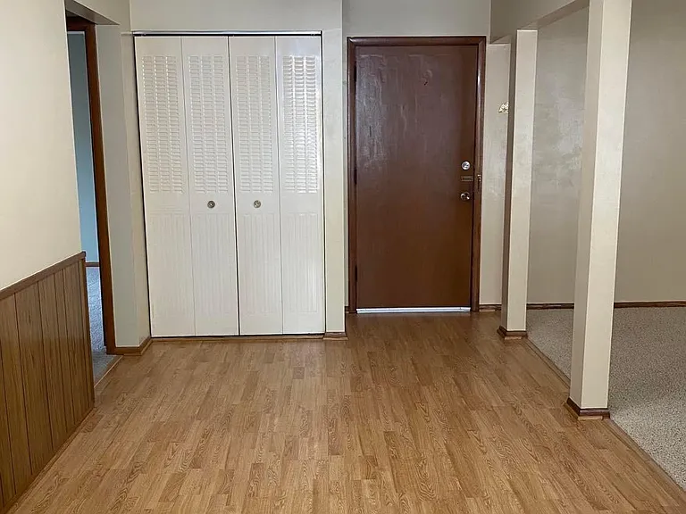 View from the kitchen into the dining area and entry way