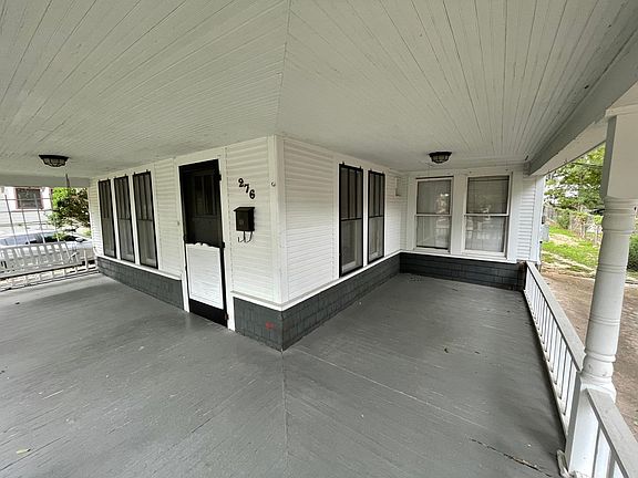 Precious wraparound porch with front porch swing