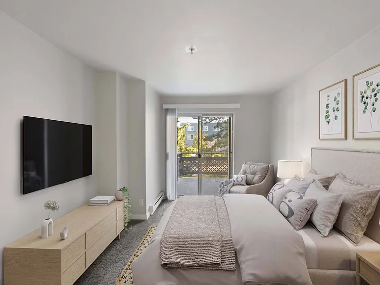 Wake up to fresh air and natural light in this peaceful bedroom with direct access to the outdoors