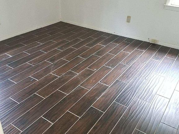 New high quality wood plank porcelain tile throughout 