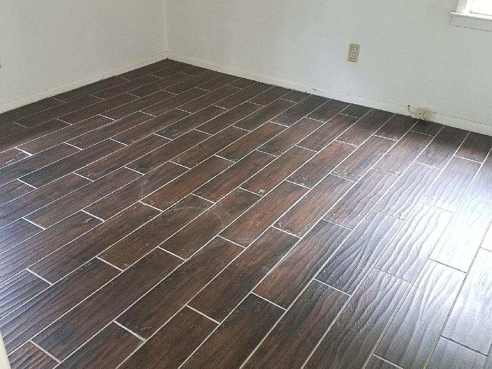 New high quality wood plank porcelain tile throughout