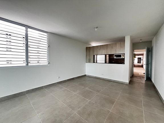 entrance, kitchen and part of the open living space with new windows