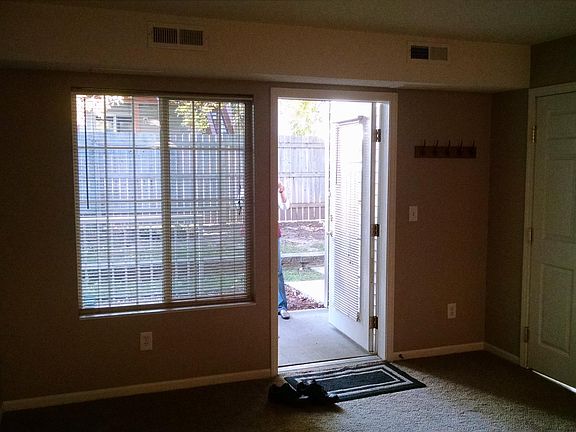 looking outside to the patio, secluded grassy area