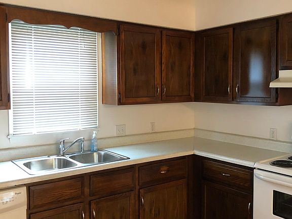 Kitchen includes dishwasher, new sink, garbage disposal, stove, refrigerator, and pantry.