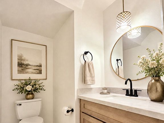 New bathroom vanity in downstairs bathroom. Furnished photos are virtually staged for reference. No furnishings are included with lease.