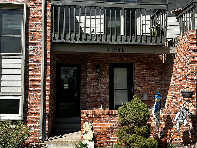 Front Entry with patio (main level and second story balcony)