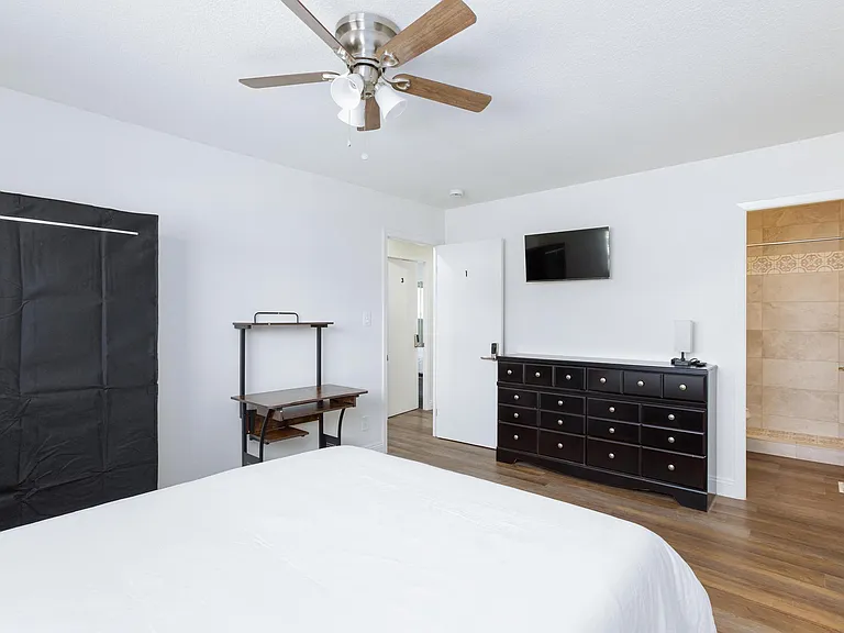 Room 1 with a Dresser, TV and private bathroom