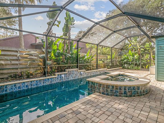 The great room opens up to this tropical oasis, allowing for fabulous indoor/outdoor living year round