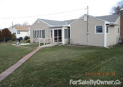 Rear
						:
						Pavers lead to 8x8 shed in yard sided with same material as house. Privacy hedge