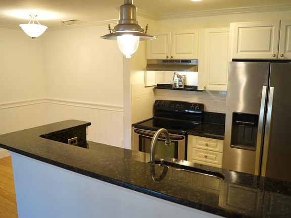 open plan kitchen-dining area open to living area.