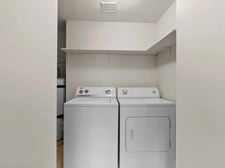 Convenient in-unit laundry with modern washer and dryer in a bright, organized space. Convenient in-unit laundry with modern washer and dryer in a bright, organized space.