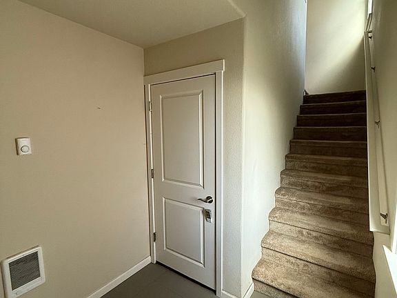 Door to Garage, stairs to main level