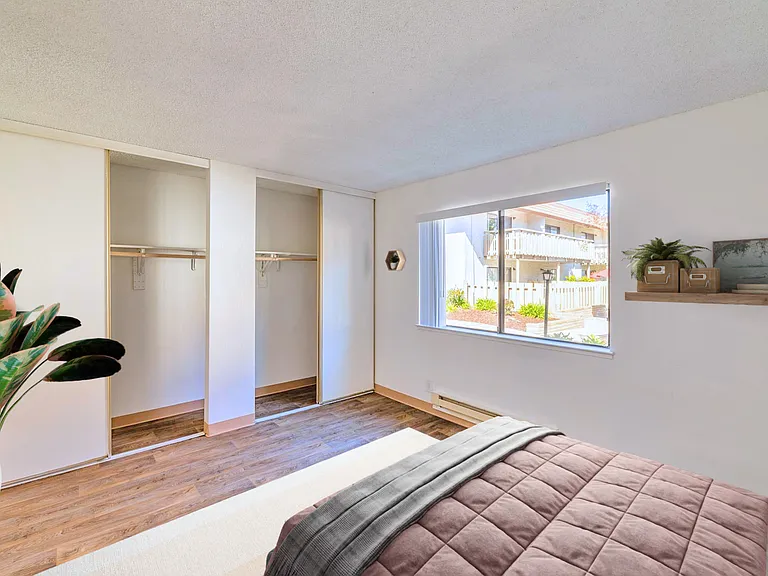 Spacious bedroom with built-in closets.