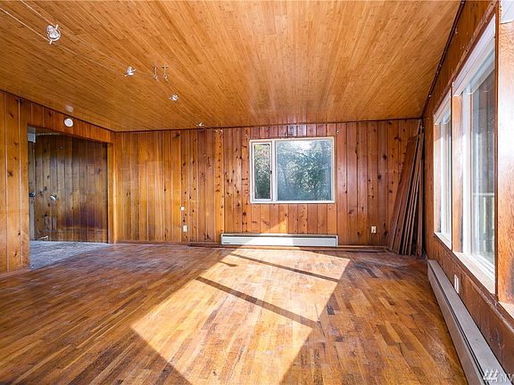 Opposite view of living room with enter to kitchen on left.  
