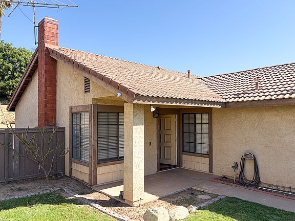 Front door / Living & Den Windows on Either Side